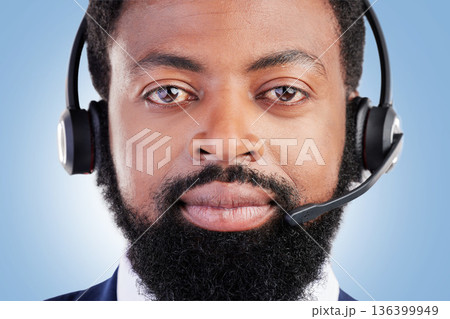 Customer service portrait, studio black man and serious consultant for tech support, help desk administration or telecom. Call center profile picture, face and African person face on blue background 136399949