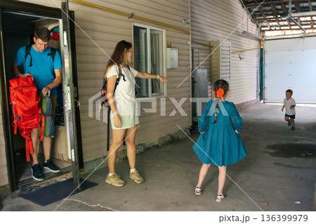 A delightful and joyful scene showcases children interacting and playing outdoors, capturing precious family moments 136399979