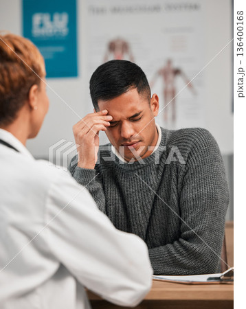 Stress, headache and doctor with patient in consultation, exam or test in hospital clinic with head pain. Burnout, fatigue and medical professional helping a tired or sick man with nursing advice 136400168