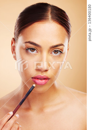 Portrait, woman or lips pencil for makeup, facial skincare or beauty cosmetics in studio or brown background. Mouth, face or model with lipstick liner product for glow, makeover or application 136400180