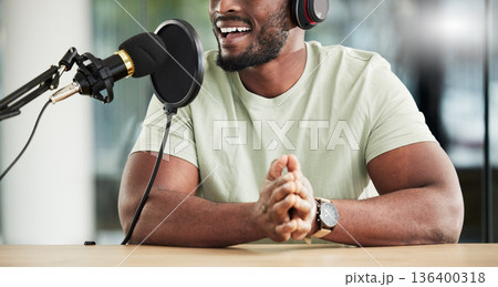 Black man, speaker and microphone, radio DJ with headphones, news communication and audio equipment. Podcast, technology and multimedia with male presenter, mouth, talk show with press and broadcast 136400318