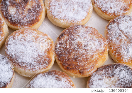 Luminous pancakes and textured syrniki, Shining golden pancakes alongside flavorful textured syrniki, Radiant pancakes with sugary syrniki providing tactile delight Luminous pancakes and textured syrniki, Shining golden pancakes alongside flavorful textured syrniki, Radiant pancakes with sugary syrniki providing tactile delight 136400594
