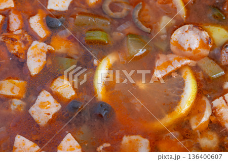 Tasty filling soup, Satisfying meat broth served hot, Flavorful spicy sausage with fresh vegetables in warm dish, Hearty savory stew with smoky sausage and vibrant garden produce Tasty filling soup, Satisfying meat broth served hot, Flavorful spicy sausage with fresh vegetables in warm dish, Hearty savory stew with smoky sausage and vibrant garden produce 136400607
