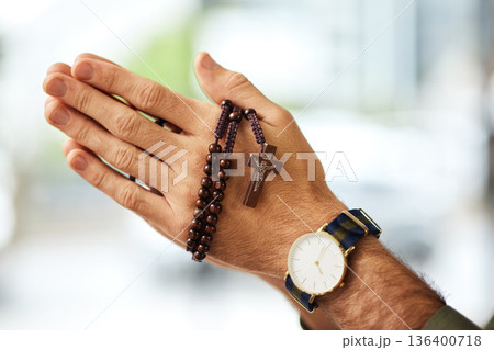 Christian man, rosary and hands praying for spiritual faith, holy gospel or worship God at church. Closeup, prayer beads and cross for support of religion, culture and praise of jesus, heaven or hope Christian man, rosary and hands praying for spiritual faith, holy gospel or worship God at church. Closeup, prayer beads and cross for support of religion, culture and praise of jesus, heaven or hope 136400718