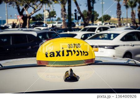 Tel Aviv, Israel, January 3, 2026 Taxis navigate the busy streets of downtown Tel Aviv, maintaining the city mobility and flow despite the ongoing regional conflict and heightened security tensions. Tel Aviv, Israel, January 3, 2026 Taxis navigate the busy streets of downtown Tel Aviv, maintaining the city mobility and flow despite the ongoing regional conflict and heightened security tensions. 136400926