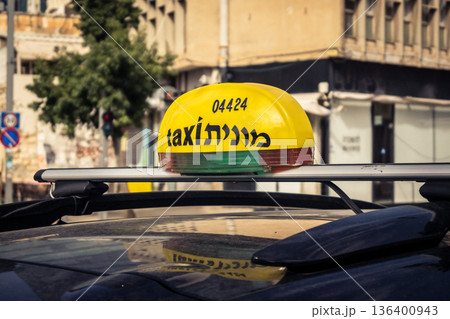 Tel Aviv, Israel, January 3, 2026 Taxis navigate the busy streets of downtown Tel Aviv, maintaining the city mobility and flow despite the ongoing regional conflict and heightened security tensions. Tel Aviv, Israel, January 3, 2026 Taxis navigate the busy streets of downtown Tel Aviv, maintaining the city mobility and flow despite the ongoing regional conflict and heightened security tensions. 136400943