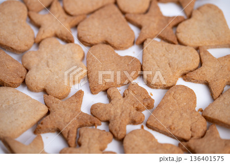 Wholegrain heart cookies with visible texture and warm brown hue, wholesome breakfast or snack concept with natural ingredients and earthy tones for healthy food content Wholegrain heart cookies with visible texture and warm brown hue, wholesome breakfast or snack concept with natural ingredients and earthy tones for healthy food content 136401575