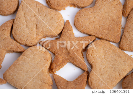 Decorative starshaped cookies on bright background evoke warmth, Circular pattern of decorated cookies with warm colors emphasizes seasonal family joyful moments Decorative starshaped cookies on bright background evoke warmth, Circular pattern of decorated cookies with warm colors emphasizes seasonal family joyful moments 136401591