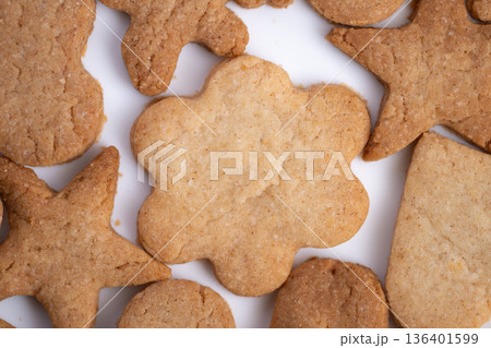 Colorful baked goods arranged beautifully for celebration, Delightful flowershaped pastries featured in cheerful flatlay for seasonal festivities and joyful occasions 136401599