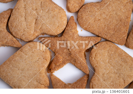 Spiced rustic cookies, Closeup of textured ginger treats, Handmade spiced cookies with sugar crystals focus, Warm flavored rustic cookies showing coarse surface and sugar details Spiced rustic cookies, Closeup of textured ginger treats, Handmade spiced cookies with sugar crystals focus, Warm flavored rustic cookies showing coarse surface and sugar details 136401601