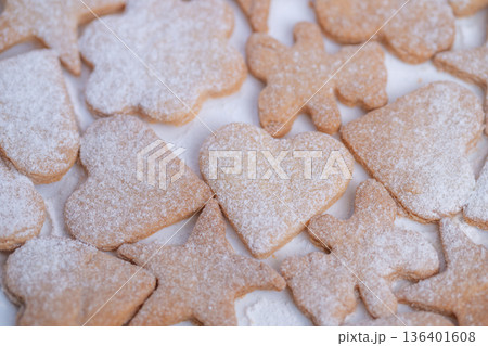 Heartshaped cookies dusted with sugar, Homemade cookies with crisp edges and soft centers, Golden heartshaped cookies layered with delicate crumbs and subtle contrast Heartshaped cookies dusted with sugar, Homemade cookies with crisp edges and soft centers, Golden heartshaped cookies layered with delicate crumbs and subtle contrast 136401608