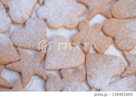 Sweet treats in charming designs, Homemade cookies with ecofriendly packaging display, Decorative sugar cookies prepped for gifts in various patterns and wrappers 136401609