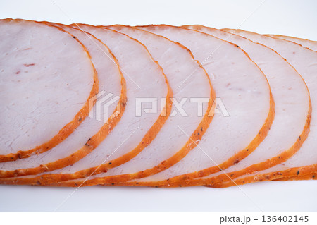 Nutritional roast slices under neutral lighting. Presentation of delicately sliced roast meat highlighting macrofriendly protein and neutral studio illumination Nutritional roast slices under neutral lighting. Presentation of delicately sliced roast meat highlighting macrofriendly protein and neutral studio illumination 136402145