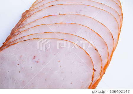 Stylish roasted slices with vibrant edges. Visually appealing photograph showcasing creatively plated roasted portions with saturated hues and refined craftsmanship 136402147