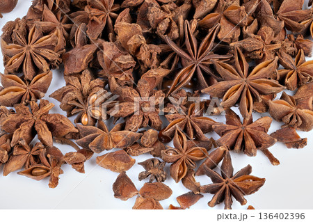 Vivid spice scent. Showcasing rich fragrance and textured pods for health uses. Highresolution image emphasizing natural aroma of star anise pods suitable for therapies Vivid spice scent. Showcasing rich fragrance and textured pods for health uses. Highresolution image emphasizing natural aroma of star anise pods suitable for therapies 136402396
