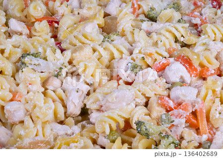 Easy chicken pasta. Creamy fusilli dinner recipe. Fast and comforting chicken pasta dish. Quick weeknight meal featuring creamy chicken pasta perfectly made in minutes 136402689