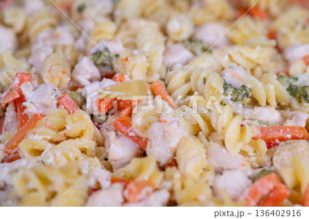 Smooth pasta with colorful vegetables. Creamy pasta combined with lively garden vegetables. Silky pasta intertwined with vibrant seasonal vegetables and flavorful herbs 136402916