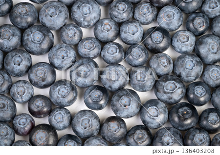 Closeup fresh blueberries dusted with bloom, bright morning light, dewy skin, vibrant blue tones, appetizing texture ideal for breakfast and healthy snack visuals Closeup fresh blueberries dusted with bloom, bright morning light, dewy skin, vibrant blue tones, appetizing texture ideal for breakfast and healthy snack visuals 136403208