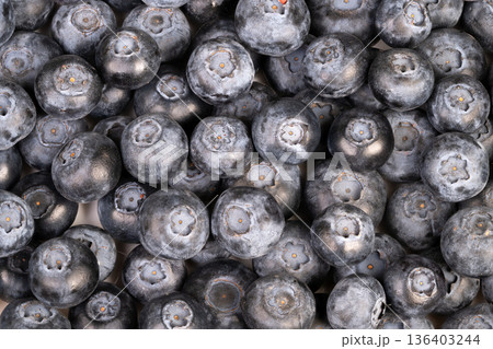 Antioxidantrich blueberry cluster nutritional concept shot highlighting superfood benefits, deep indigo tones and textured bloom evoke health and wellness messaging Antioxidantrich blueberry cluster nutritional concept shot highlighting superfood benefits, deep indigo tones and textured bloom evoke health and wellness messaging 136403244