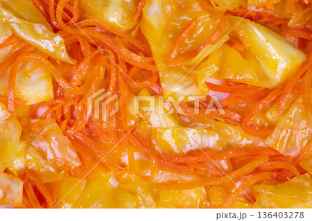 Colorful fermented vegetables. Vibrant shredded vegetables with spicy chili oil. Brightly colored shredded carrot and cabbage in spicy chili oil for culinary presentation Colorful fermented vegetables. Vibrant shredded vegetables with spicy chili oil. Brightly colored shredded carrot and cabbage in spicy chili oil for culinary presentation 136403278