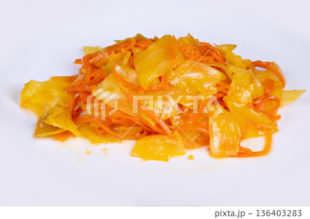 Brightly colored fermented vegetable side dish. Stylish restaurant image highlighting vibrant vegan cabbage paired with carrots and flavorful sesame garlic seasoning 136403283