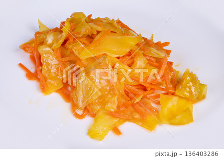 Korean style fermented carrots and cabbage. Comfort food display featuring homemade Korean pickled vegetables resting on rustic countertop in warm natural sunlight Korean style fermented carrots and cabbage. Comfort food display featuring homemade Korean pickled vegetables resting on rustic countertop in warm natural sunlight 136403286