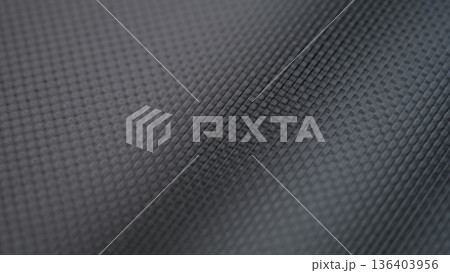 Textured surface displaying intricate geometric patterns in rich dark tones, creating a sense of modern elegance and depth in design 136403956