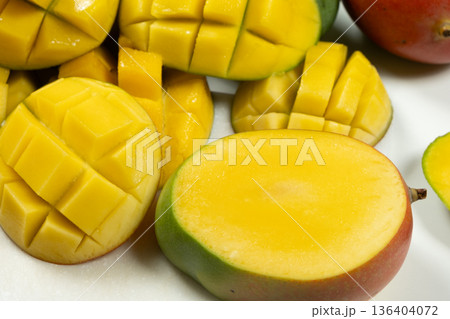 Sweet tropical mango slices with smooth yellow pulp. Sweet tropical mango slices with smooth yellow pulp. 136404072