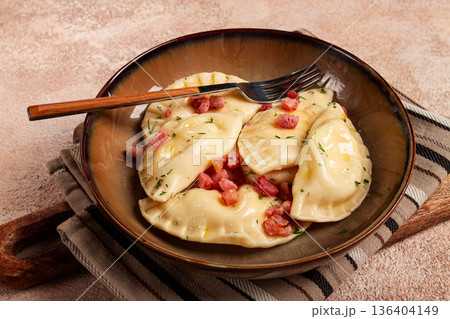 Dumplings, with fried prosciutto, a traditional dish of Polish cuisine, dumplings, top view, close-up, without people, Dumplings, with fried prosciutto, a traditional dish of Polish cuisine, dumplings, top view, close-up, without people, 136404149