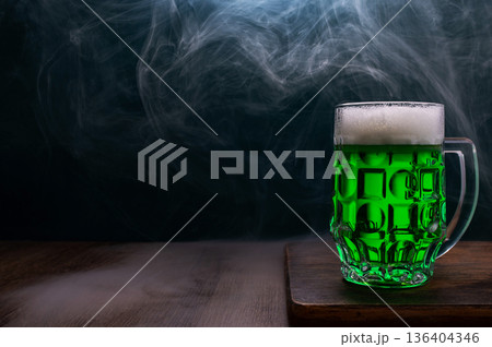 Green beer, hat and clover leaves on grey wooden table. St. Patrick Day celebration 136404346