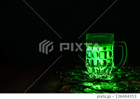 Green beer, hat and clover leaves on grey wooden table. St. Patrick Day celebration 136404353
