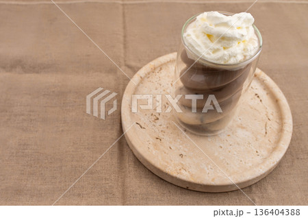 Hojicha Latte with Roasted Green Tea and Powder on Beige Background Hojicha Latte with Roasted Green Tea and Powder on Beige Background 136404388