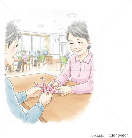 介護施設で折り紙を楽しむ高齢女性と女性介護士のコピースペース付き水彩画イラスト 136404604