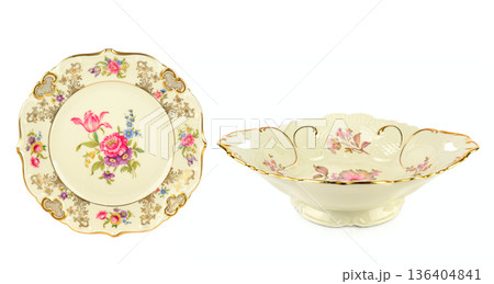 Elegant vintage porcelain plate and fruit bowl with floral patterns Elegant vintage porcelain plate and fruit bowl with floral patterns 136404841