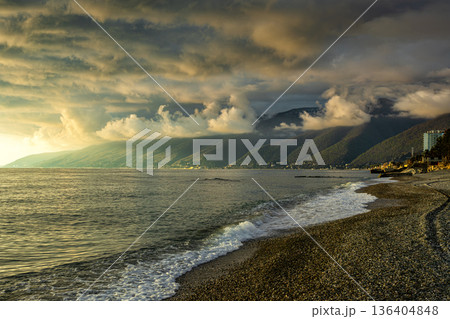 Sunny evening with overcast low clouds after rain at a seaside resort Sunny evening with overcast low clouds after rain at a seaside resort 136404848