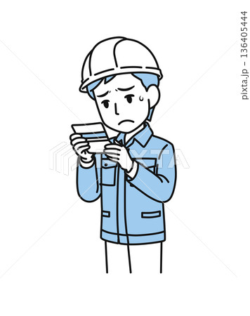 通帳の残高を見て落ち込むヘルメットを被った作業服の男性のイラスト素材 136405444