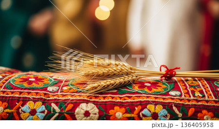 Baisakhi festival celebration concept with wheat ears on Punjabi Phulkari embroidery background. Baisakhi festival celebration concept with wheat ears on Punjabi Phulkari embroidery background. 136405958