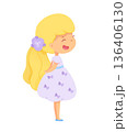 Little girl with blonde hair in a playful dress adorned with butterflies standing happily with a smile 136406130