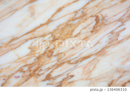 Beautiful marble surface showcasing rich patterns in warm tones from nature's artistry 136406310