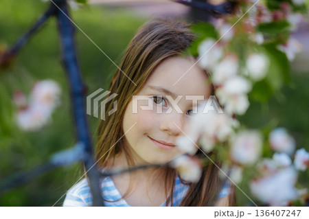 Young girl in spring nature. 136407247