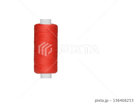 Red spool of sewing thread isolated on white background Red spool of sewing thread isolated on white background 136408253