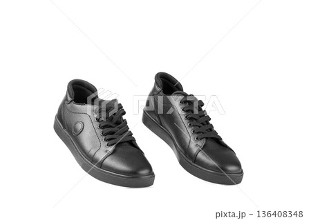 black leather sneakers on a white background black leather sneakers on a white background 136408348
