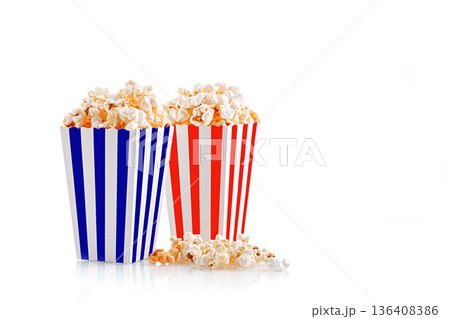 Glass with popcorn on a white background Glass with popcorn on a white background 136408386