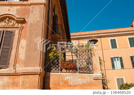 Traditional Italian balcony on historic building in Rome 136408520