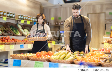 Eco food vegetable market, man worker and mango. 136408930
