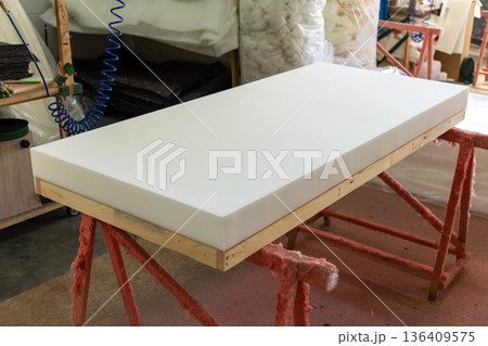 White polyurethane foam attached to a wooden frame White polyurethane foam attached to a wooden frame 136409575