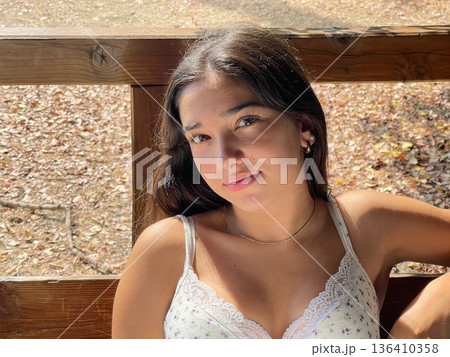 Natural portrait of a teenage girl around 13 to 14 years old. The image captures youthful expression, innocence, and personal identity. Ideal for themes like adolescence, education, lifestyle, emotion Natural portrait of a teenage girl around 13 to 14 years old. The image captures youthful expression, innocence, and personal identity. Ideal for themes like adolescence, education, lifestyle, emotion 136410358