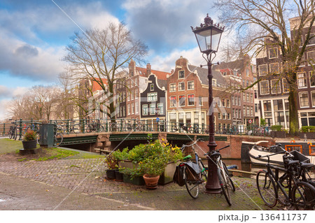 Traditional Canal Houses with Bicycles in Amsterdam, Netherlands 136411737