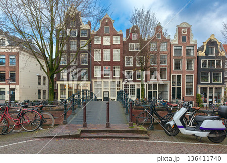Traditional Canal Houses with Bicycles in Amsterdam, Netherlands 136411740