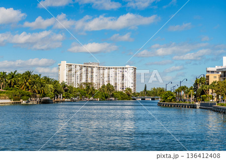 Hotel building architecture. Residential high rise hotel. Modern building. Residential apartment in waterfront city. City waterfront with house. Vacation building in summer. Luxury waterfront house Hotel building architecture. Residential high rise hotel. Modern building. Residential apartment in waterfront city. City waterfront with house. Vacation building in summer. Luxury waterfront house 136412408